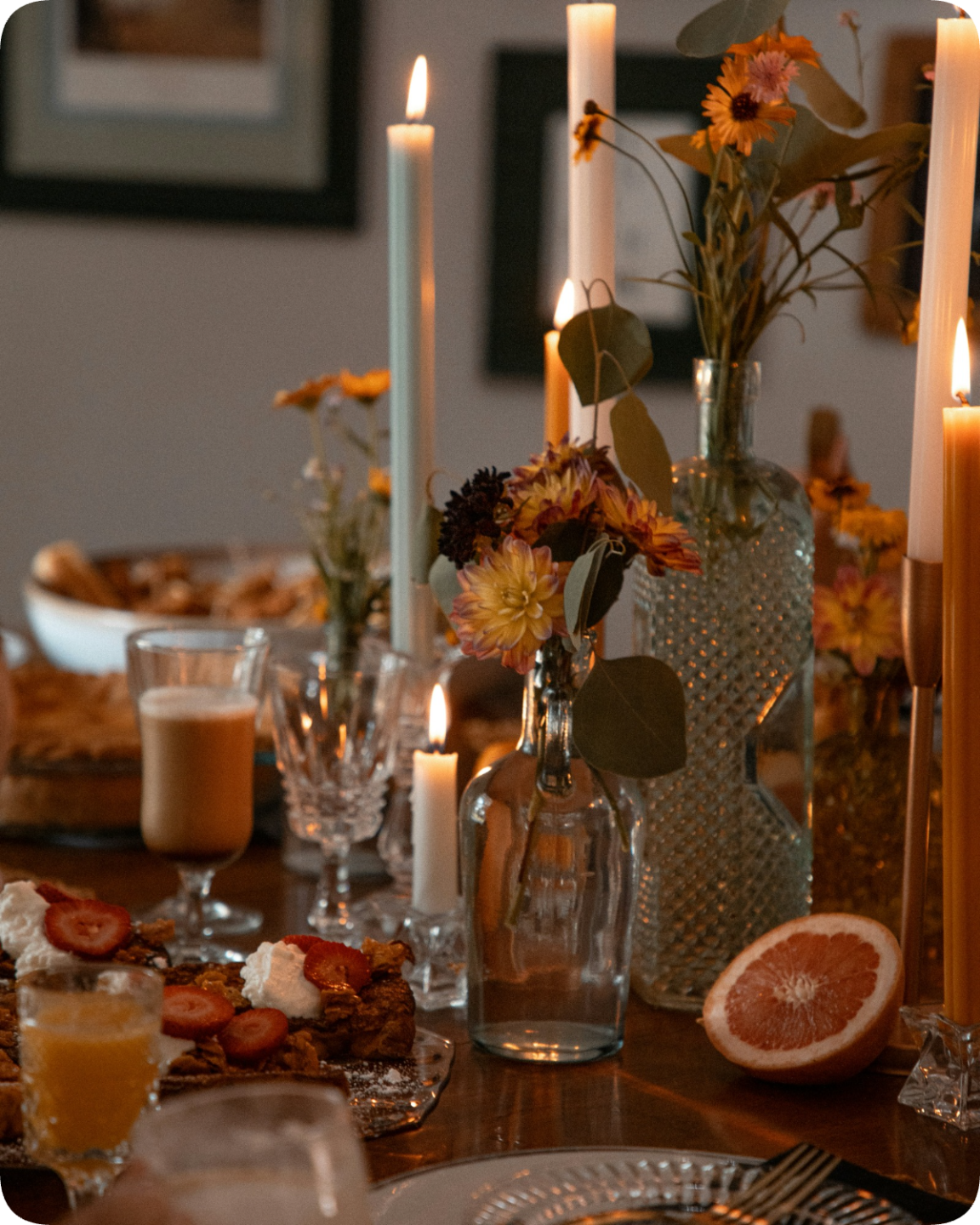 Close-up of bare feet stepping onto a checkerboard tile floor in an elegant home kitchen, evoking the relaxed feel of an in-home dining evening