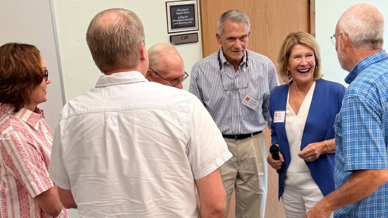 Gail Perry with board members