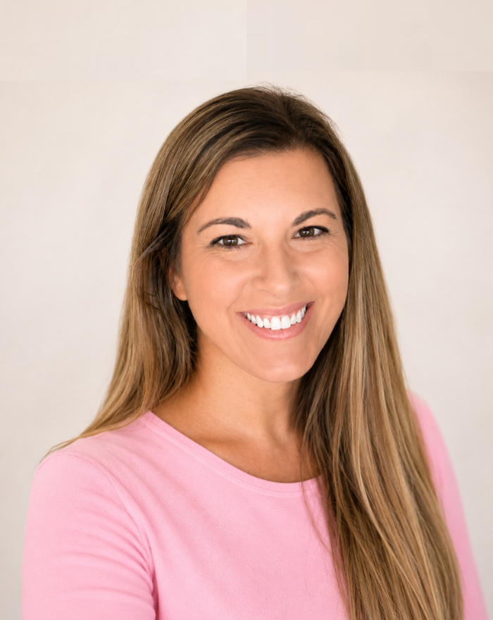Angie Knight, founder of The Modern Help, wearing a pink shirt