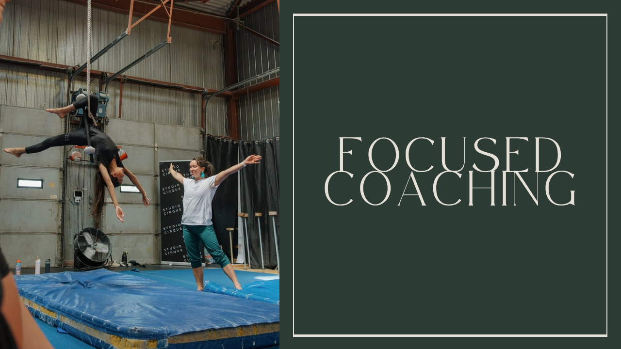 Enya White coaching with her arms out to the side. Focused Coaching.