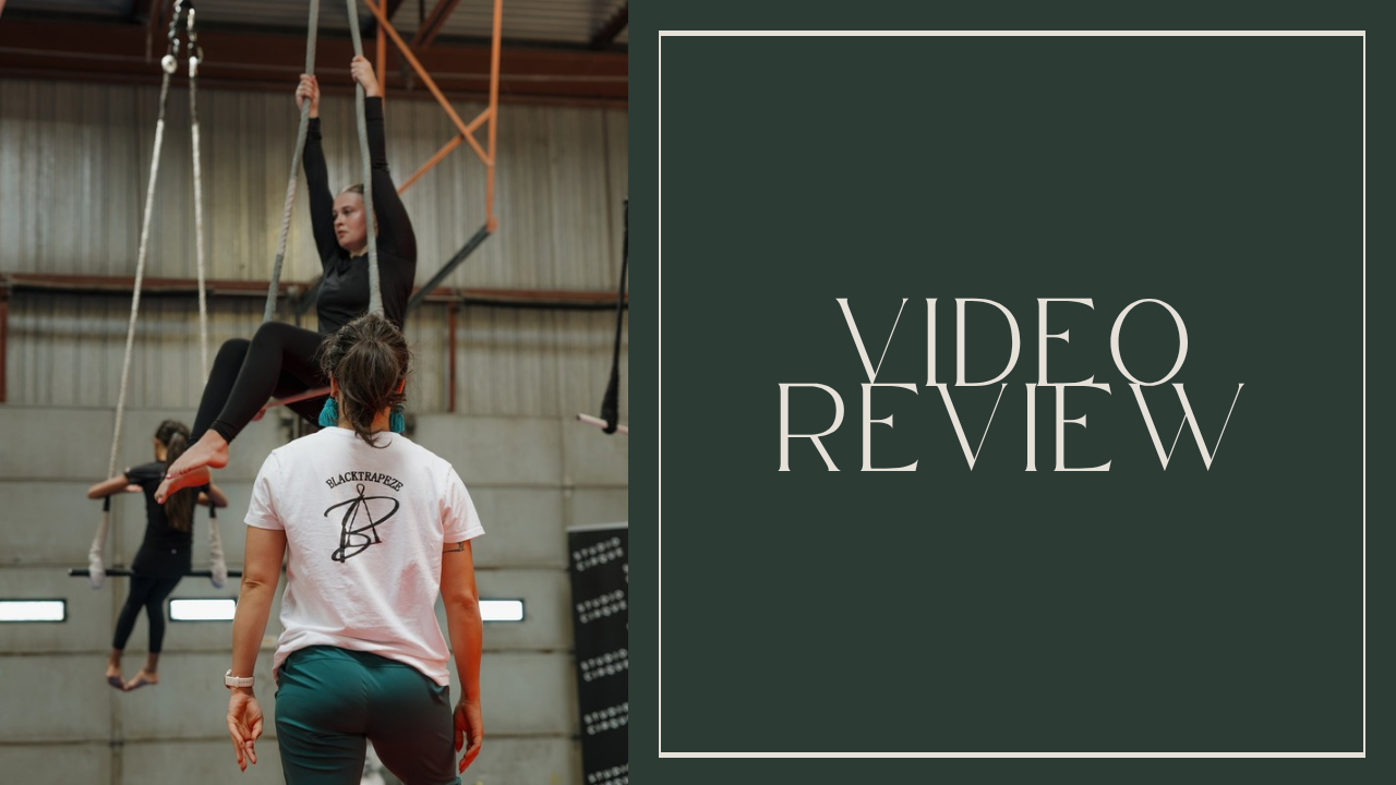 Enya White coaching a student on trapeze. Video Review.