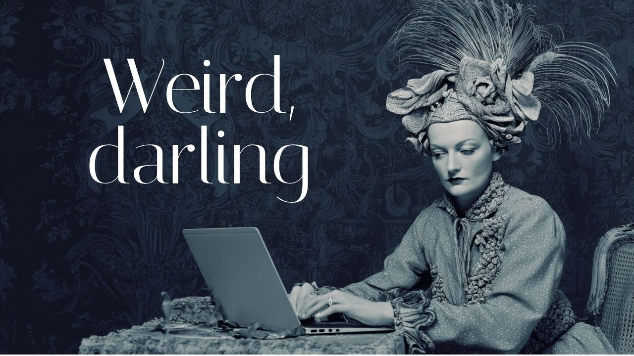 woman wearing a feathered headdress typing on a laptop