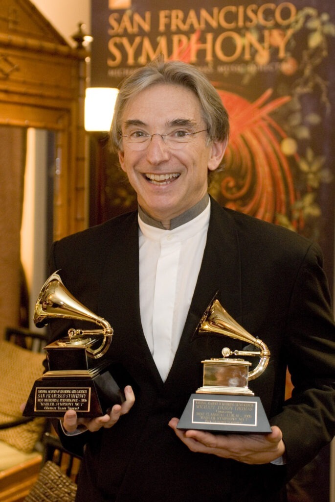 Michael Tilson Thomas holding Grammy Awards