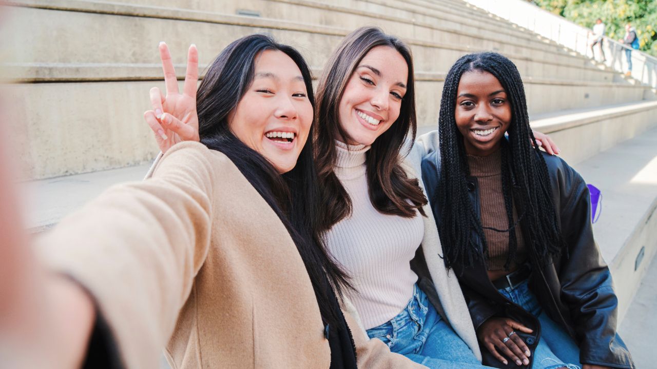 three friends smiling 