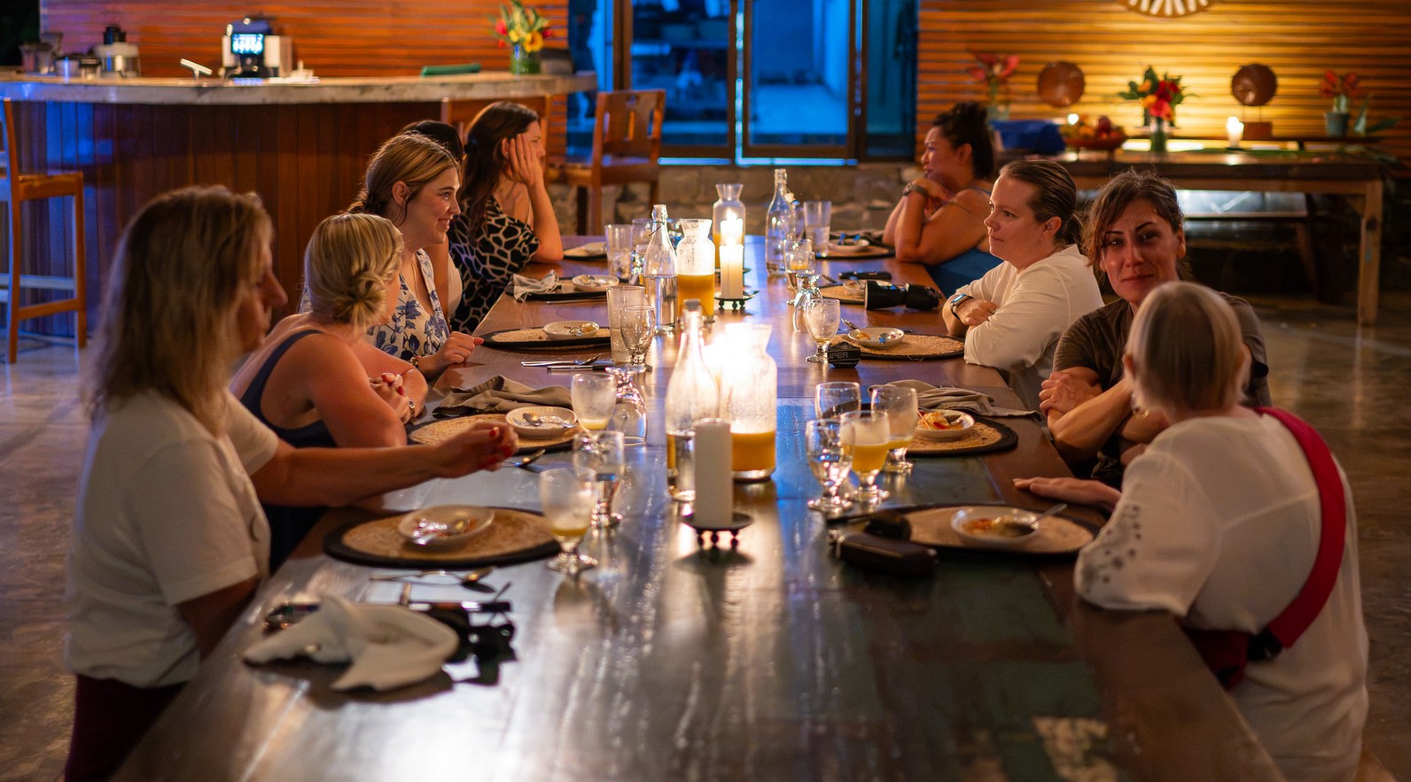 Women gathered around the dinner table during a Rooted Reset™ experience