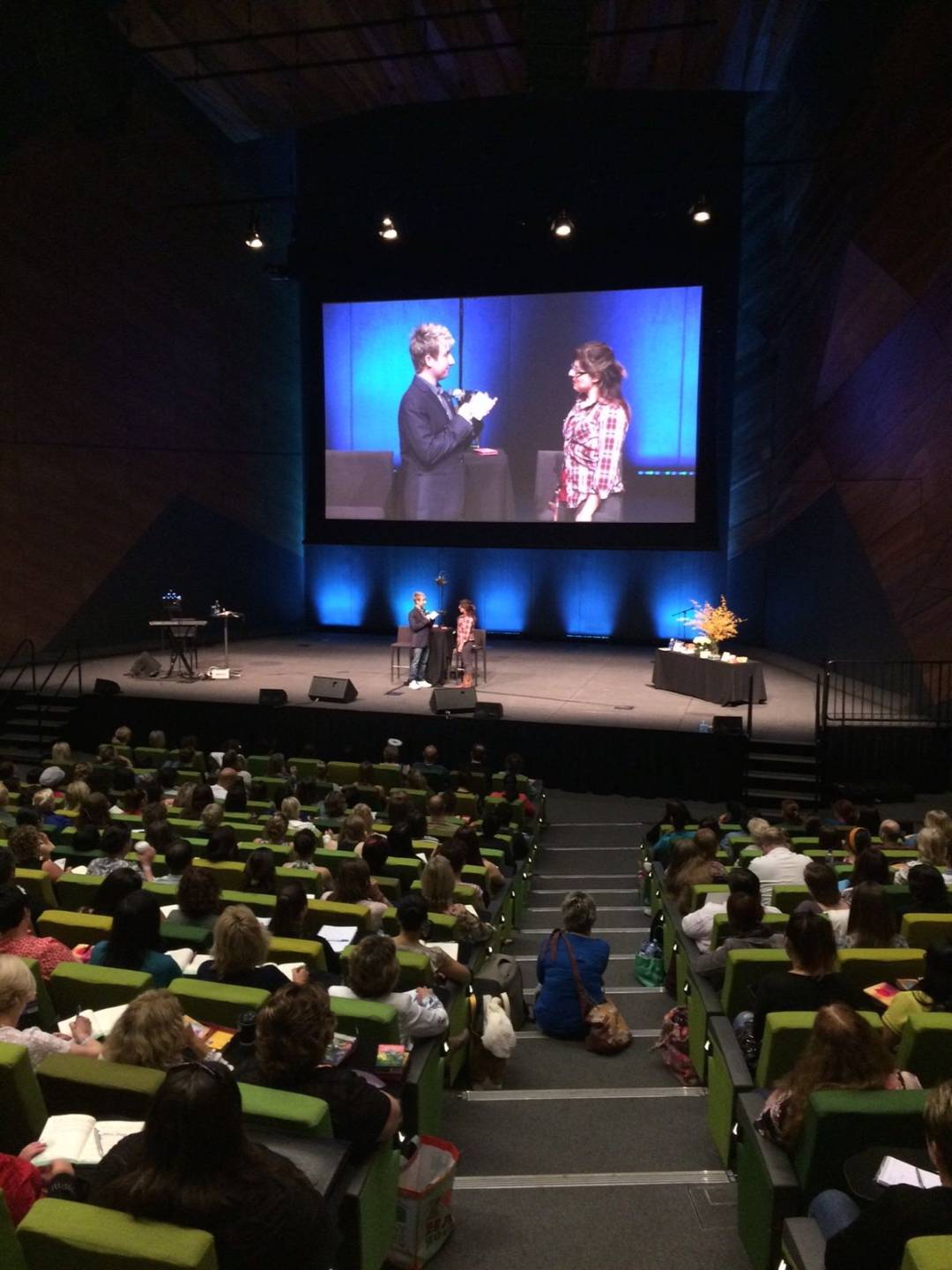 Robert Reeves teaching on stage in an auditorium