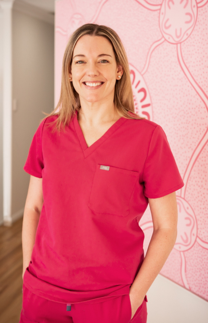 Dr Kate Moriarty supporting a mother and baby