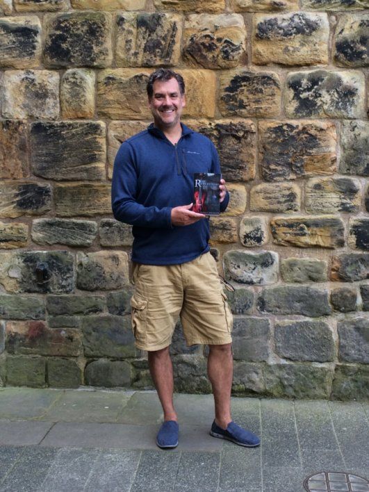 Dan with the book at Alnwick Castle