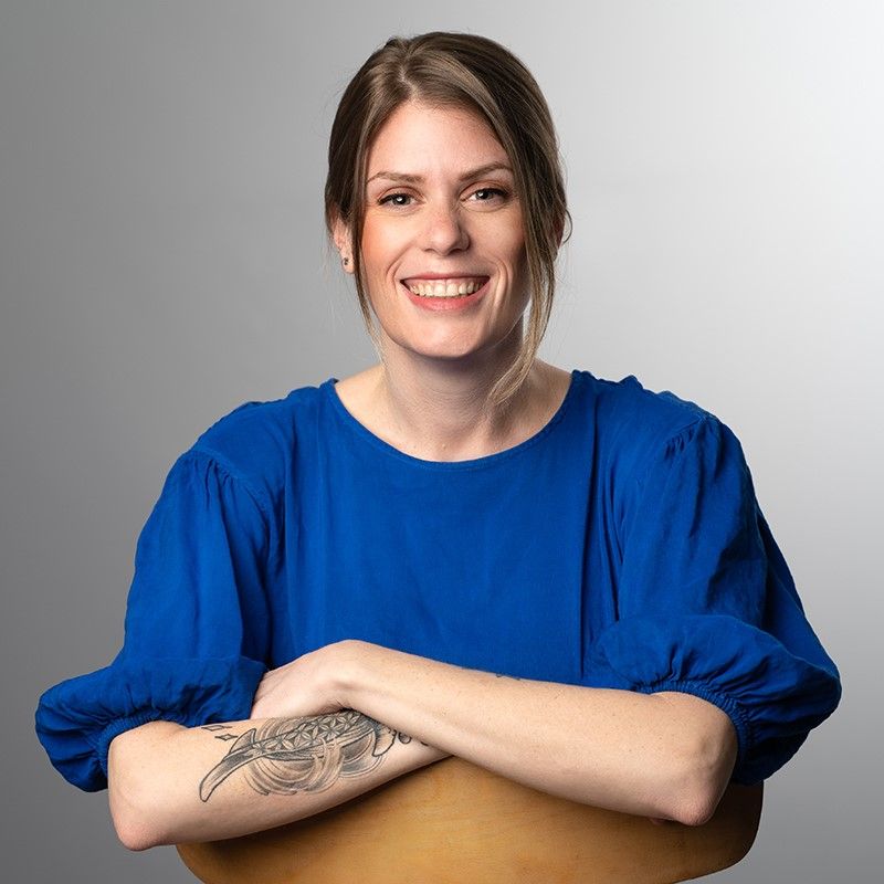 meditator kim has a blue shirt on and is smiling