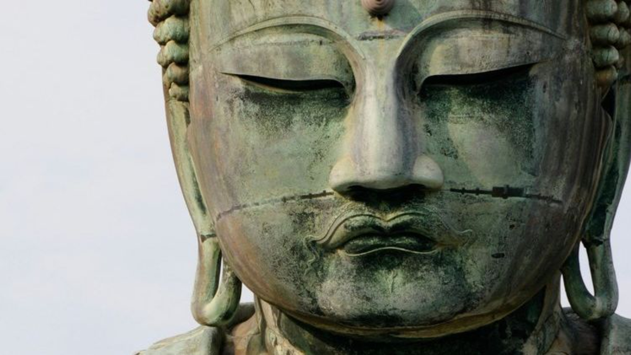 eyes closed in third eye meditation statue 