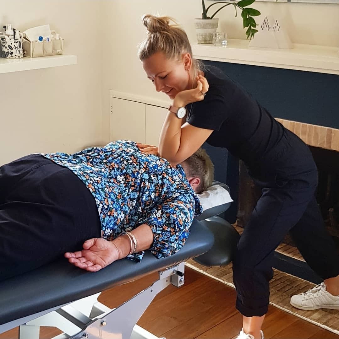 Nicola Wearne applying a soft tissue technique to the upper back.