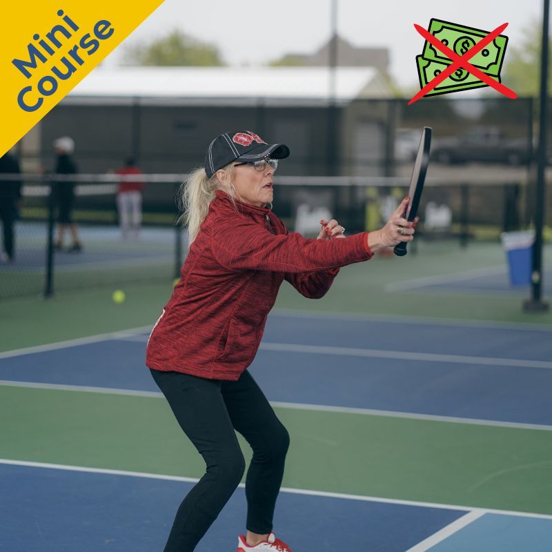 Player hitting a volley from the non-volley zone line at camp