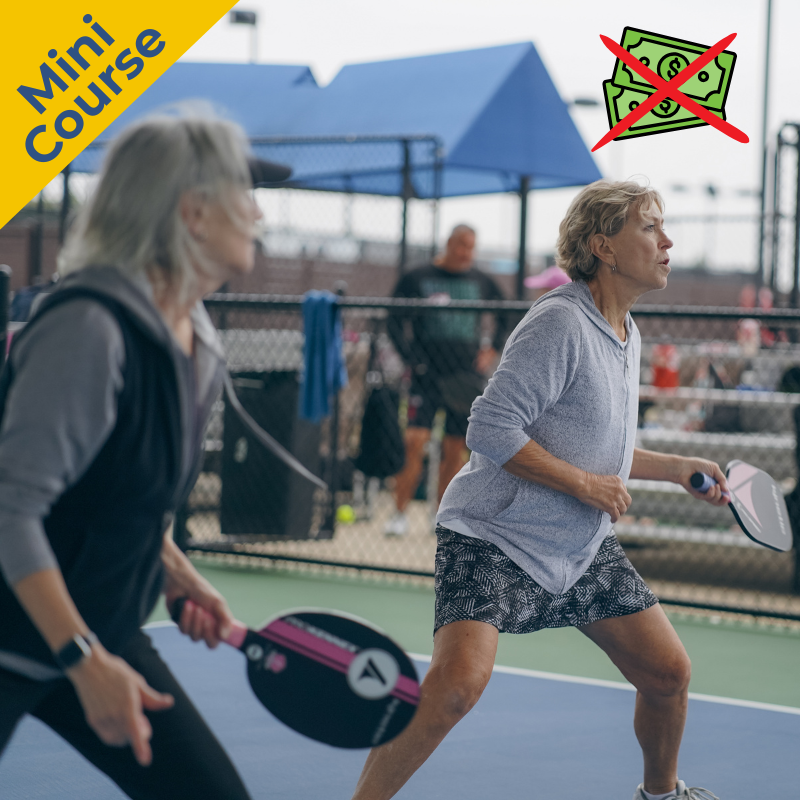 Pickleball doubles partners at the non-volley zone line at camp