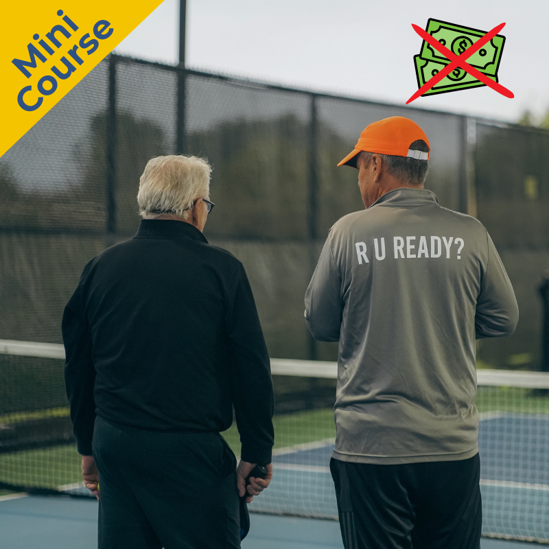 Tony Roig coaching a player at camp.