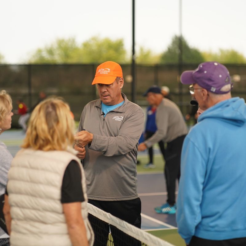 Tony Roig Pickleball coaching players at camp..