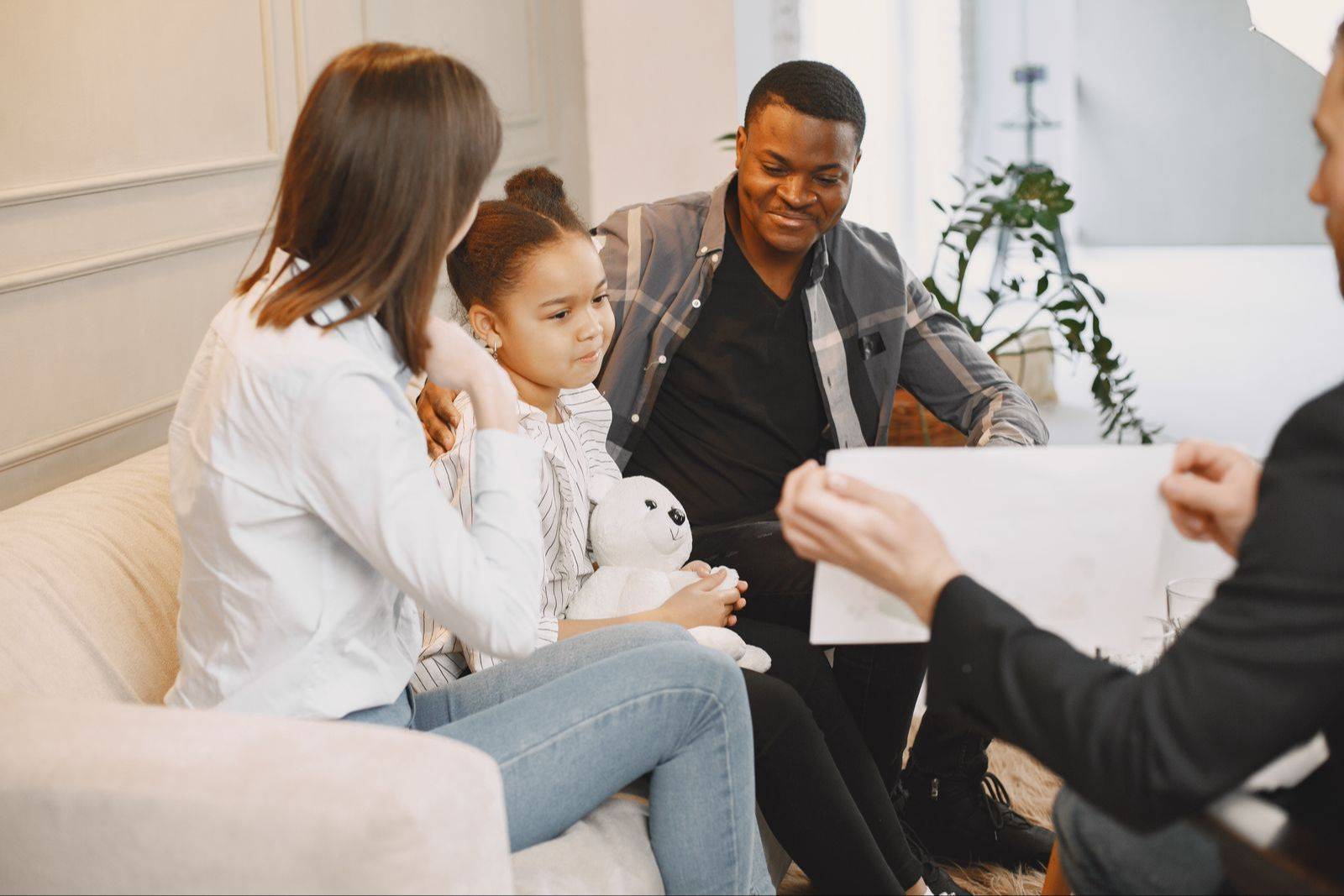 Child welfare professional meeting with a family