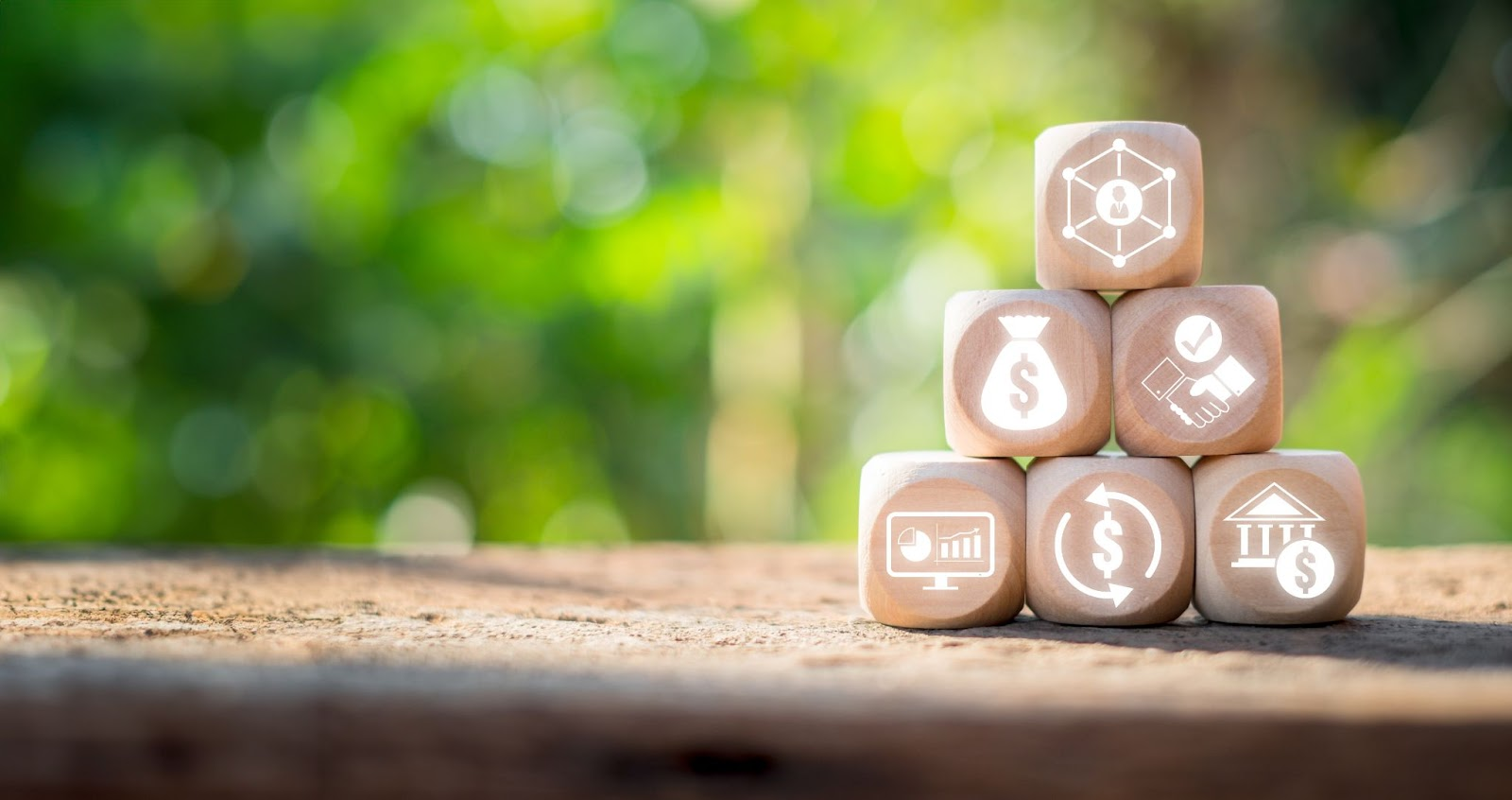 Wooden blocks stacked in a pyramid with icons