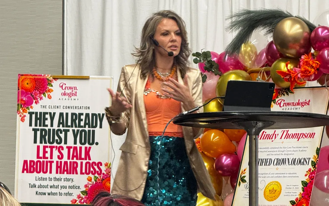 Kayla teaching at the hair show.