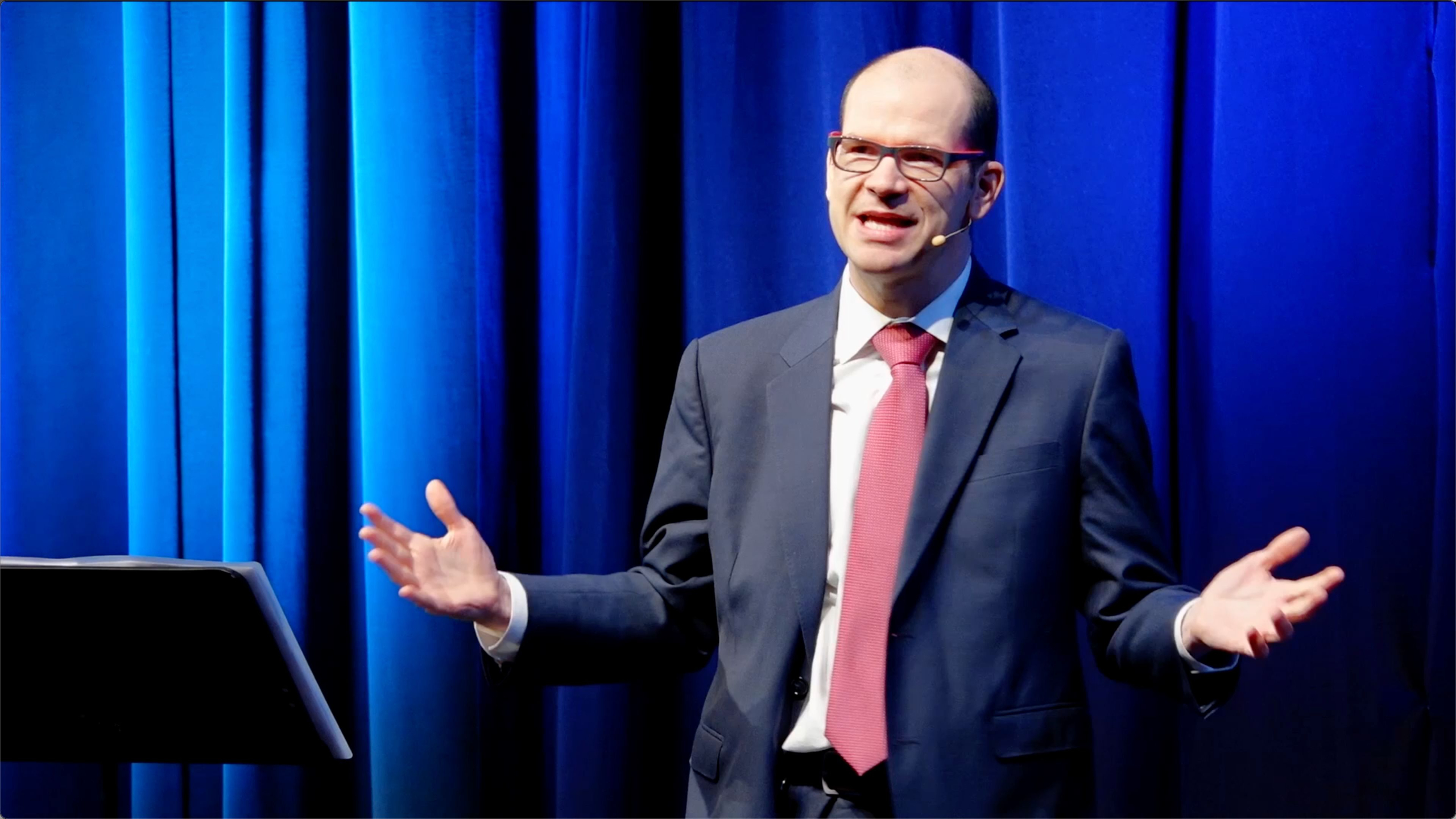 Andrew Lock speaking on stage