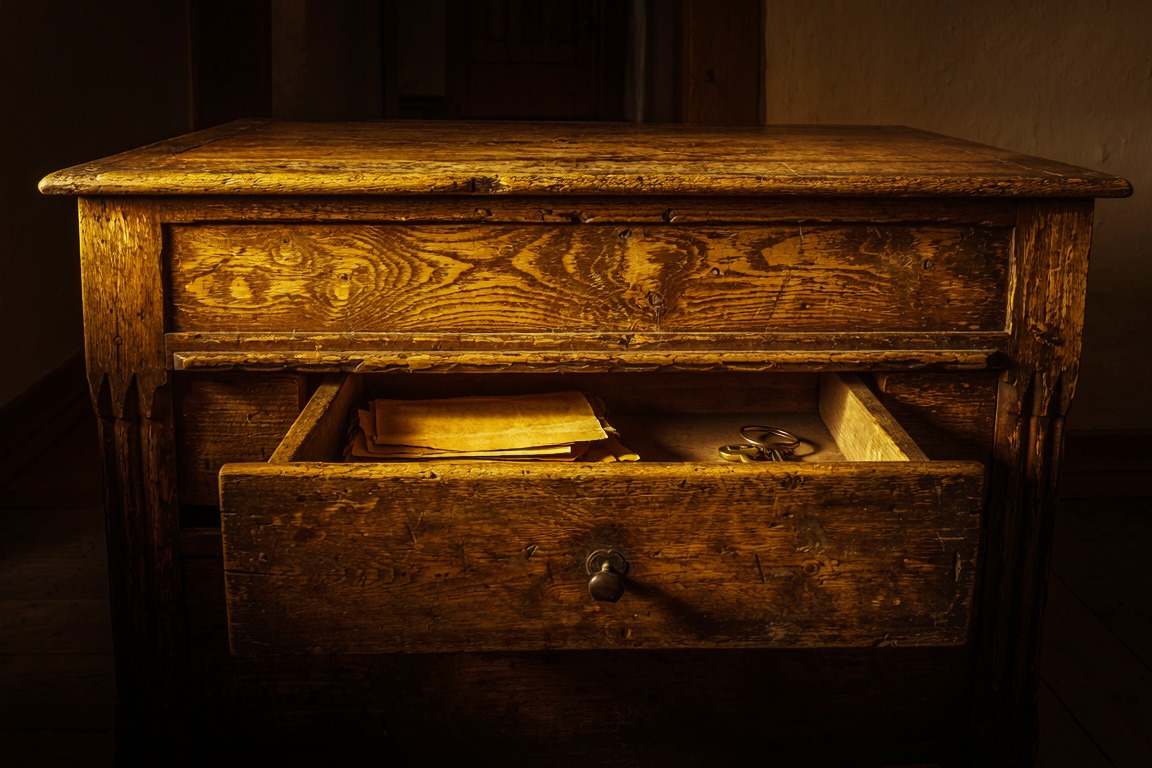 An old sideboard with one drawer pulled half open