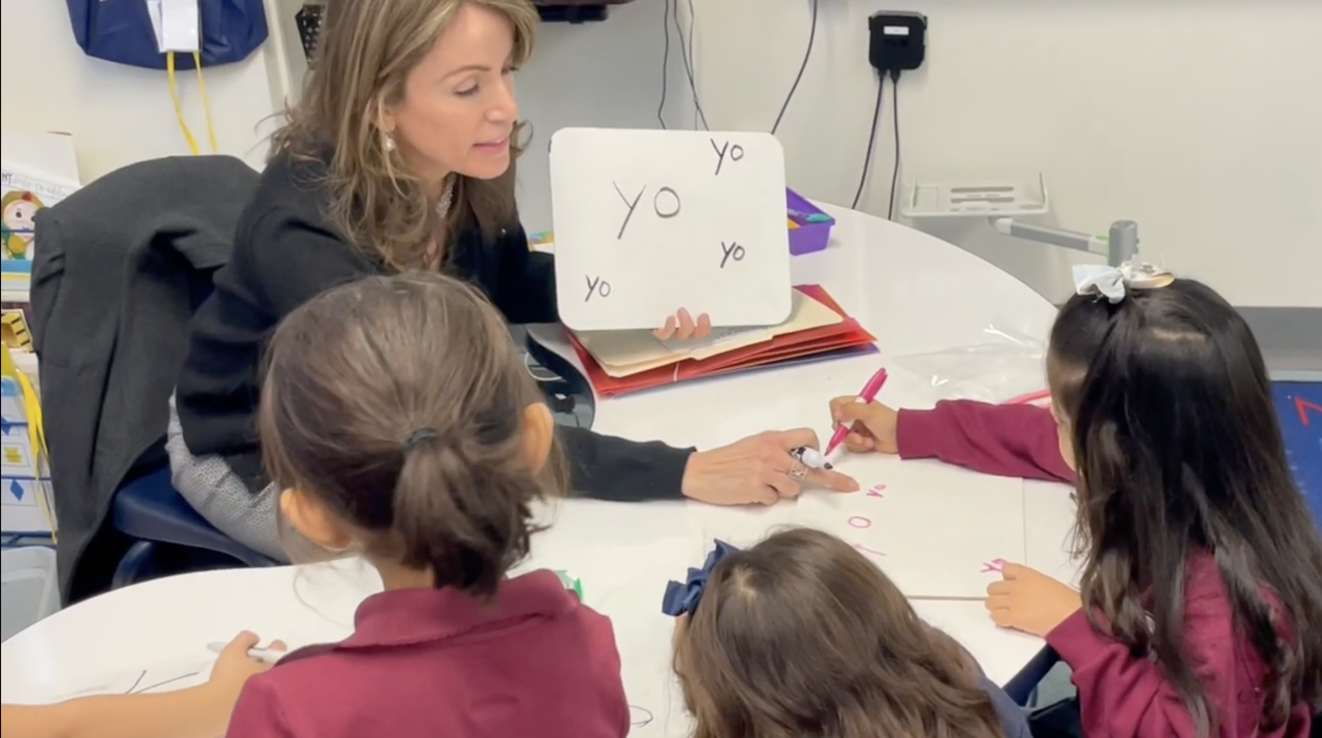 Gloria working with students during literacy instruction