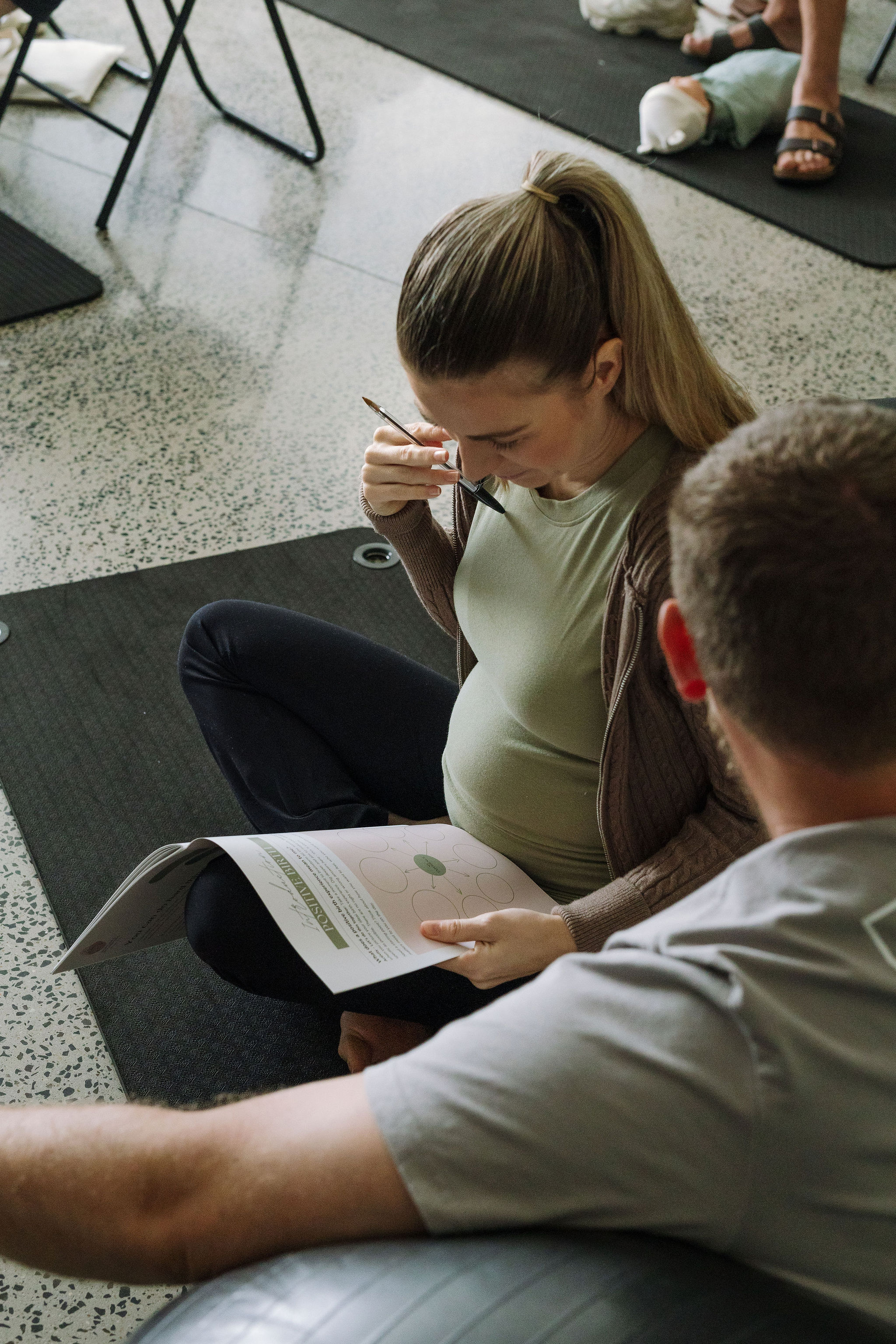 A couple reading the Empowered Birth booklet