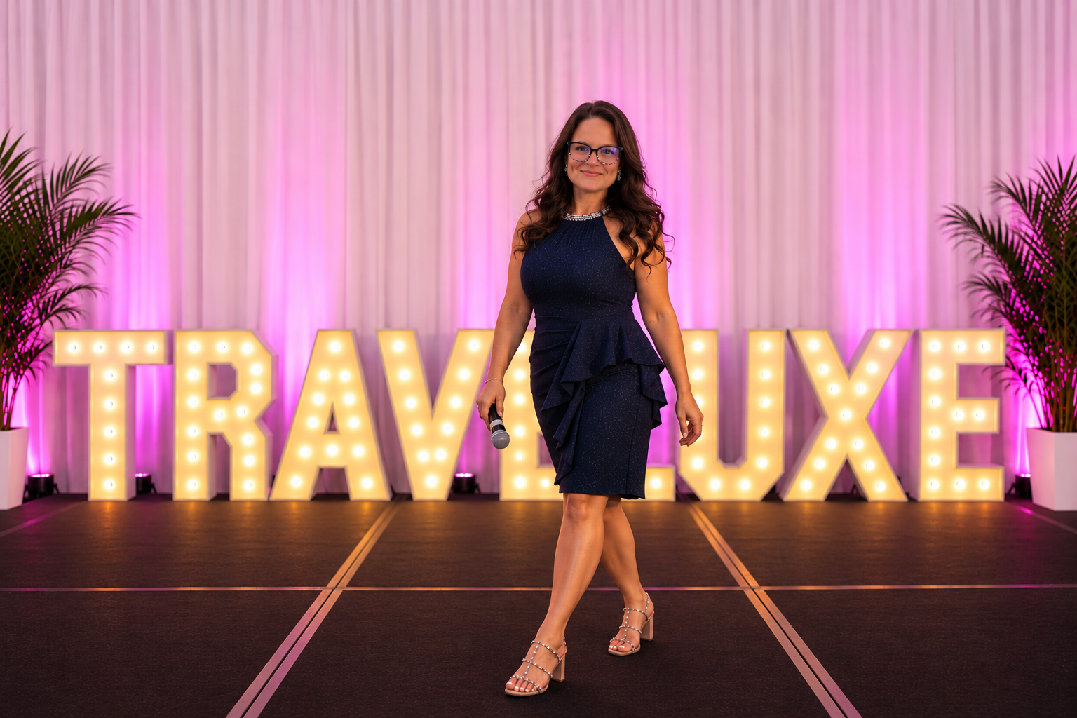 Traveluxe founder Meg Kinnerk speaking on stage
