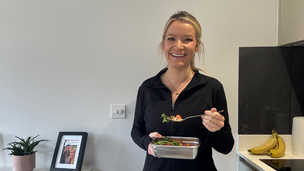 Amy eating healthy food in the kitchen