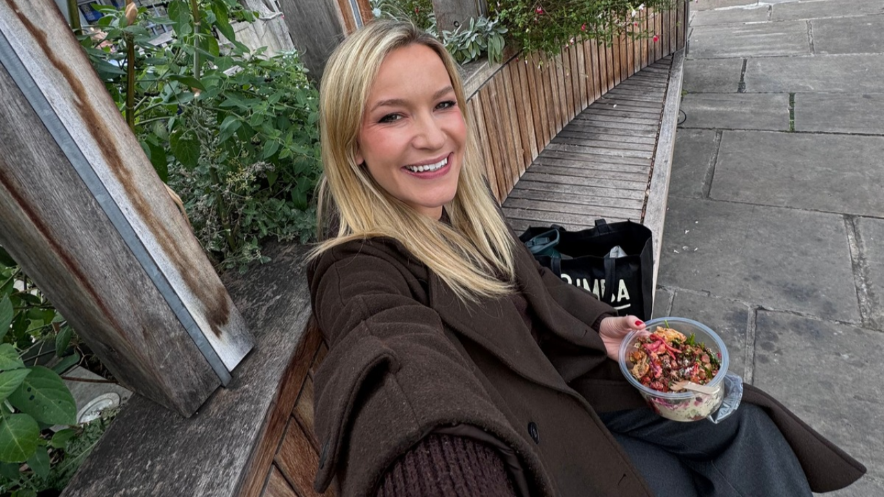 Woman sitting on a bench with a healthy lunch
