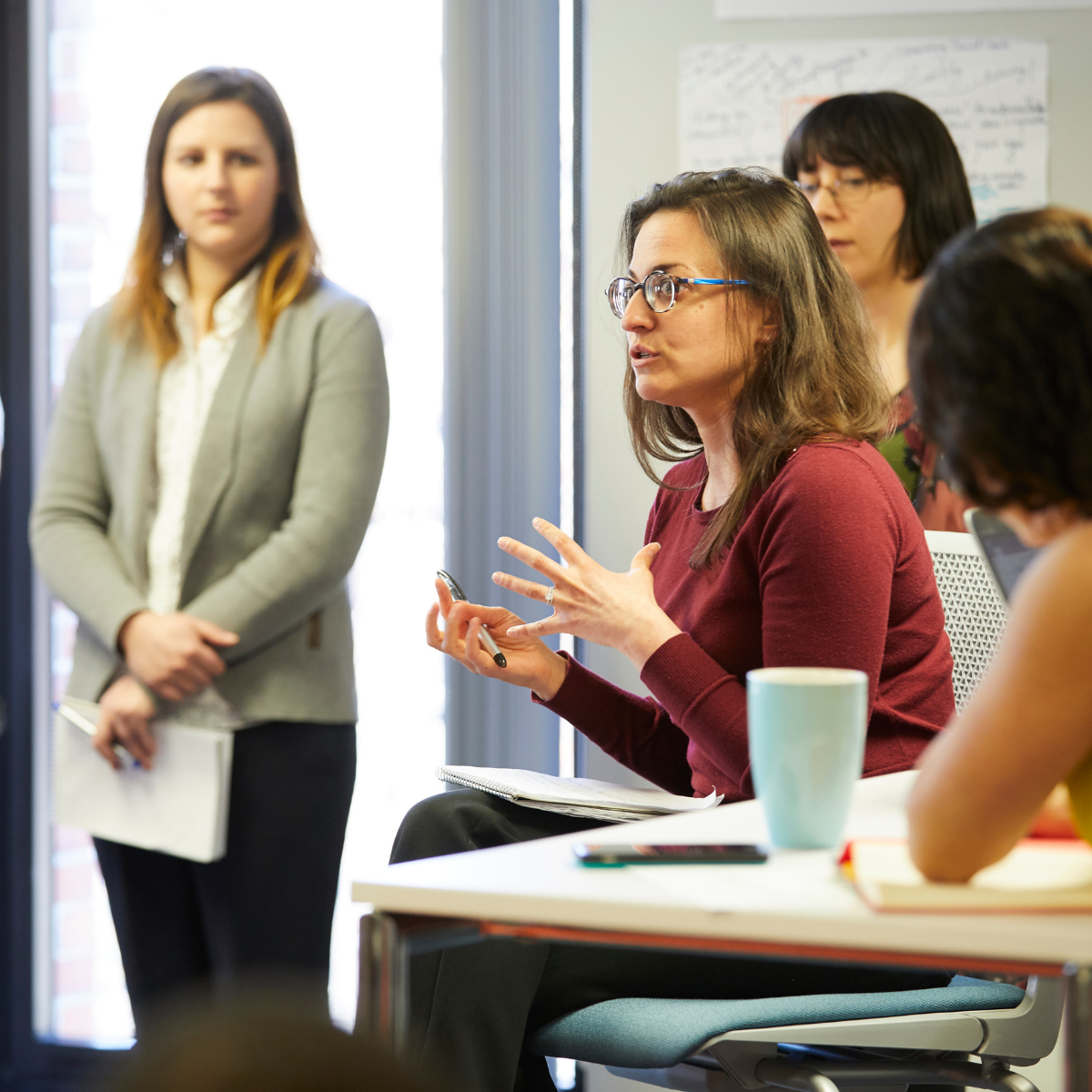 Jenn Felsted-Knight speaking with participants during a group discussion