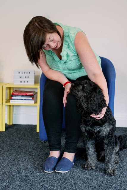 Beshlie in her coaching room with her dog