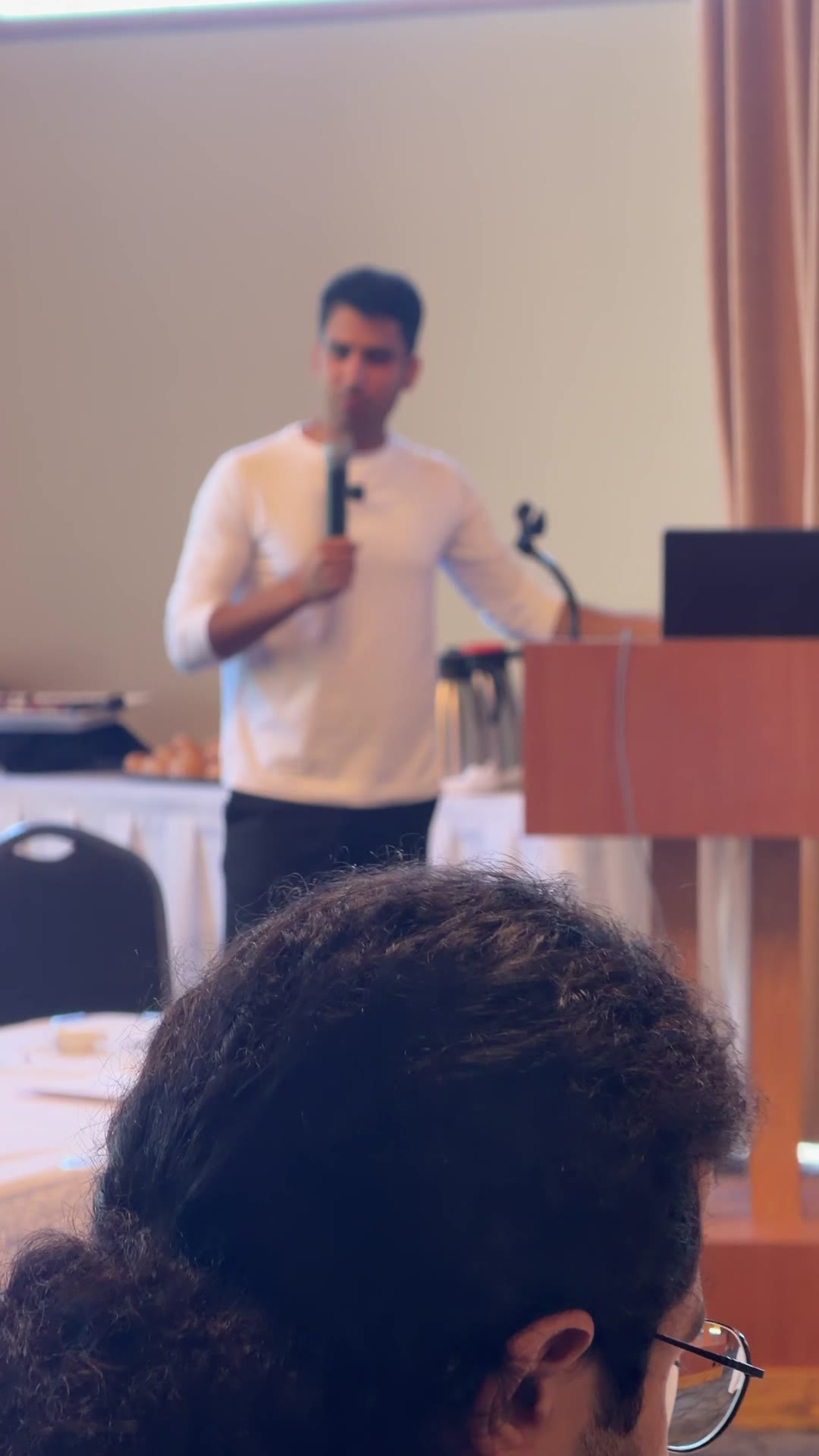 Ali answering questions at a Vela K event