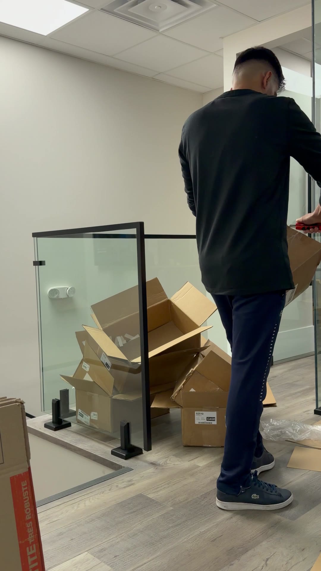Ali opening a shipment in the office