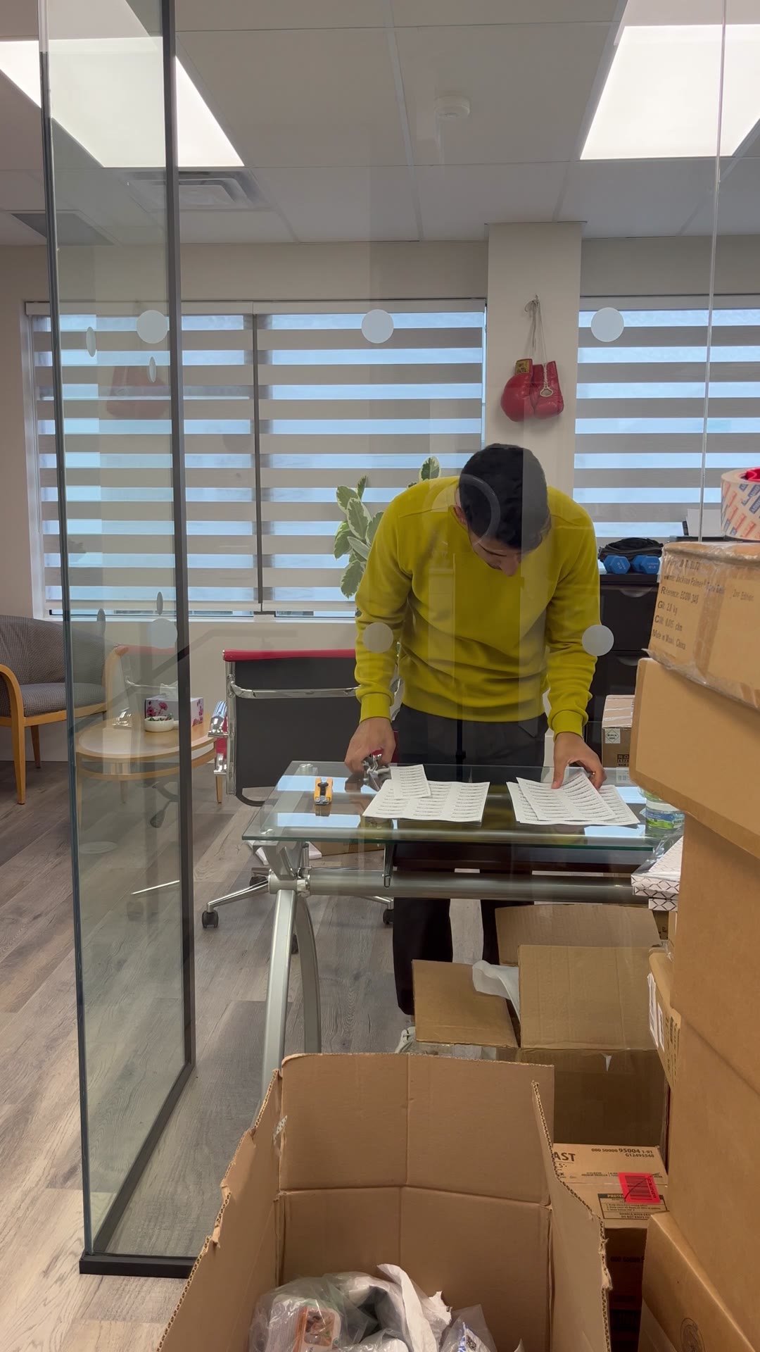 Ali packing an order at the office desk