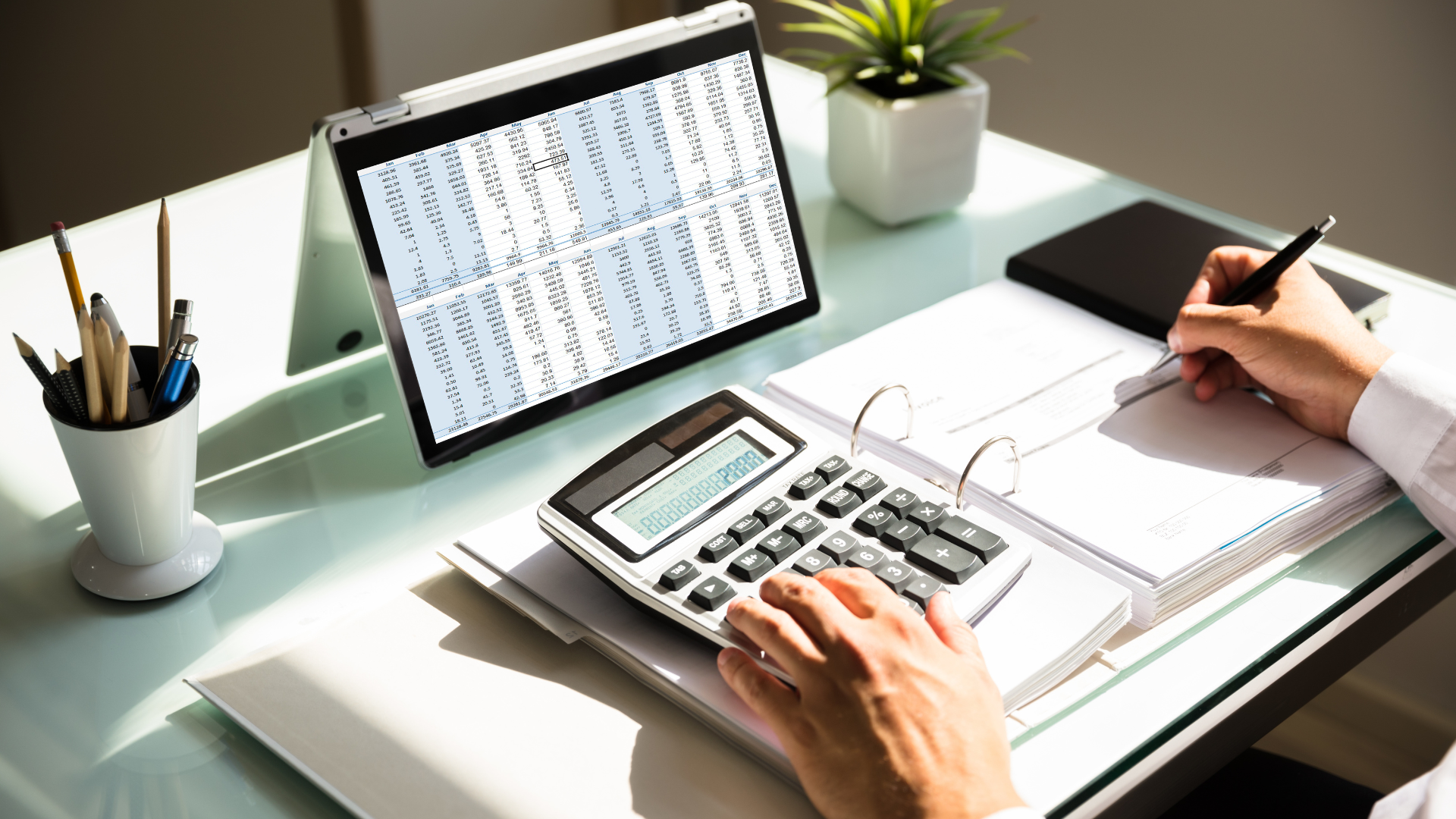 Spreadsheet and calculator on a desk