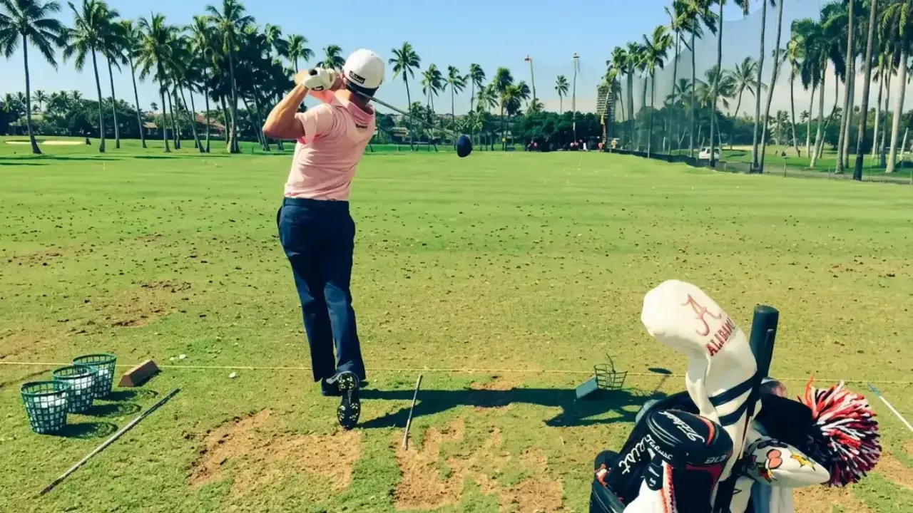 Justin Thomas swinging a driver on the range