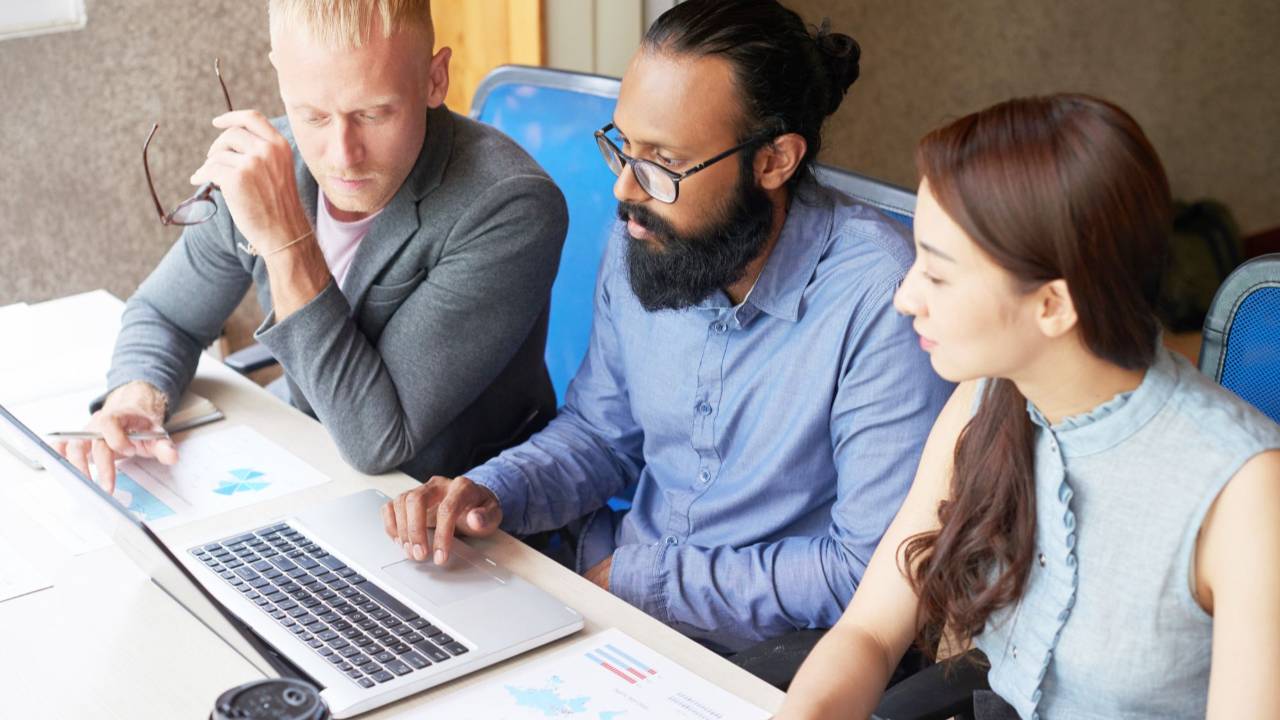 Leaders collaborating in a technology-enabled workplac