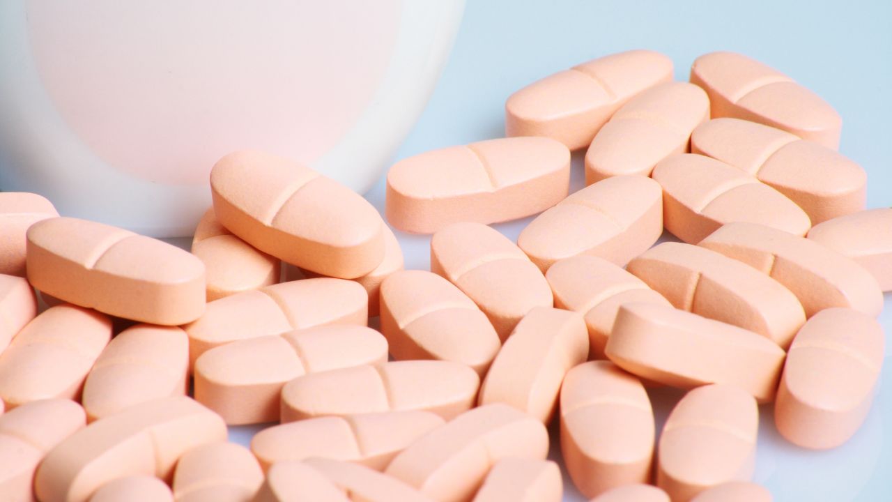 Peach-colored supplement tablets