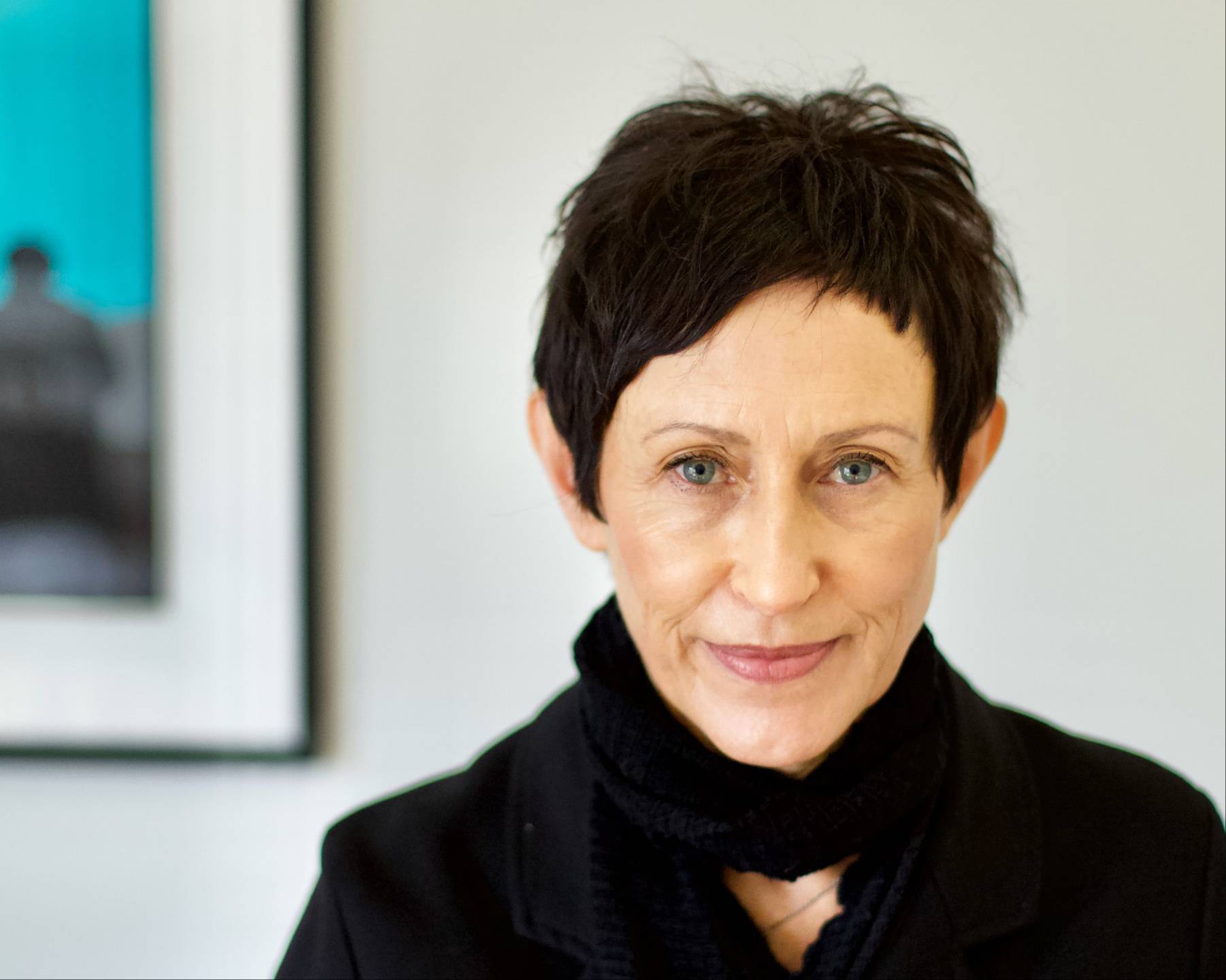 Portrait of Chrissie Catling looking at the camera indoors.