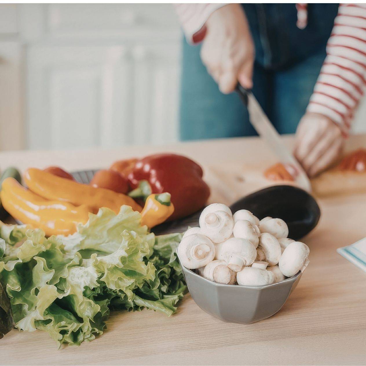 Woman's hands cutting vegetables