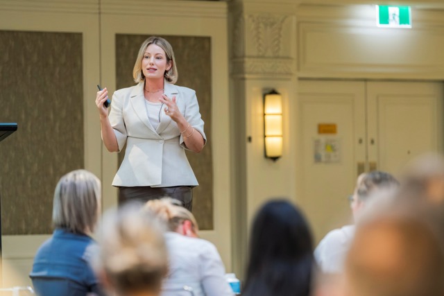 Tamara Reid presenting to an engaged audience