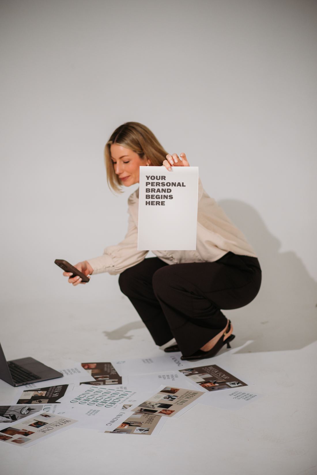 Tamara Reid holding a page that reads Your personal brand begins here