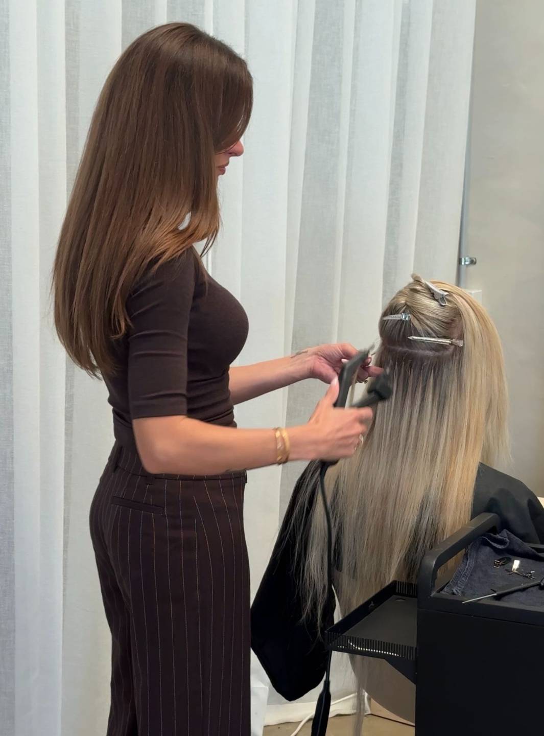 Keratin bond hair extension application showing clean sectioning and placement