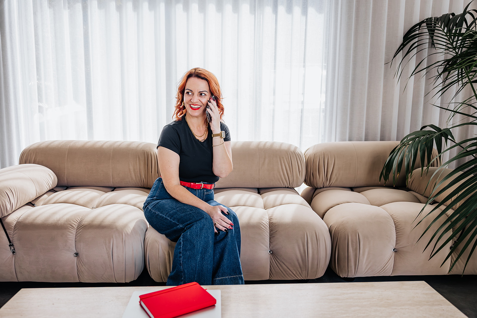 Kate Elizabeth, High Performance Mindset Coach, with her red journal