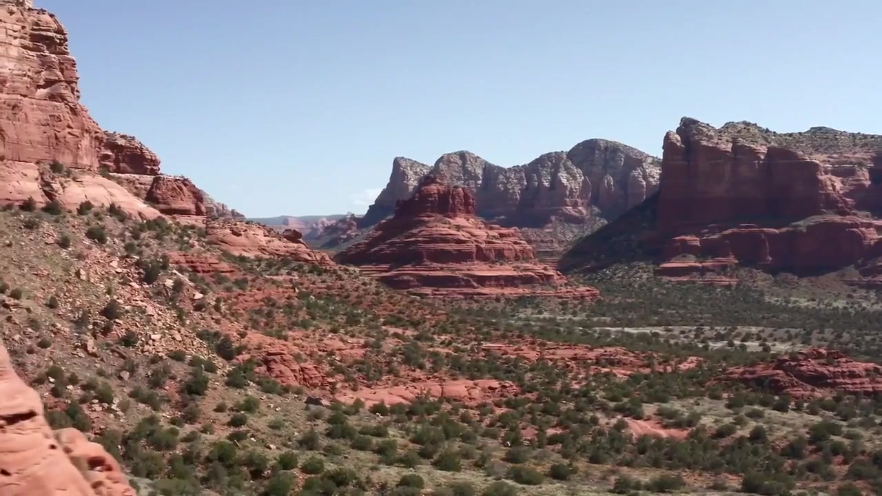 Wide view across Sedona’s red-rock mountains and desert valley