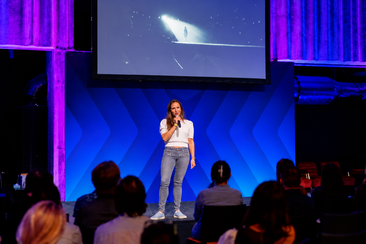 Sara Jodoin speaking on stage at MVU 2026; other speakers removed from the photograph