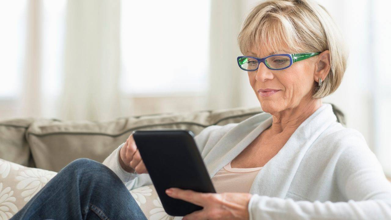 Woman using an iPad to explore health and wellness information