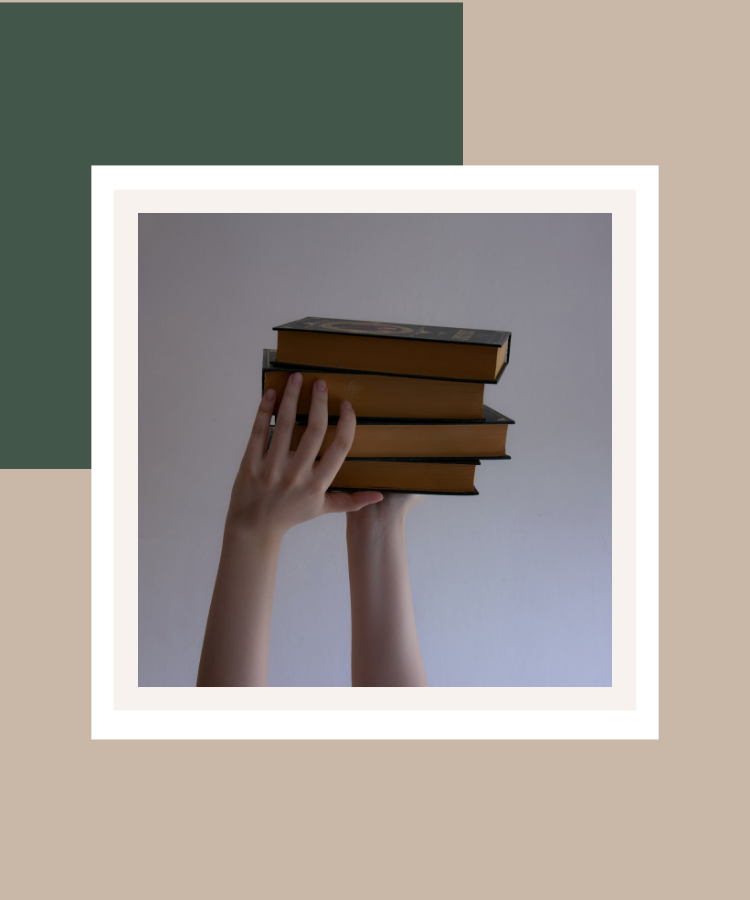 Hands holding a stack of books against a neutral background, presented in a white photo frame with deep sage green and beige colour blocks.