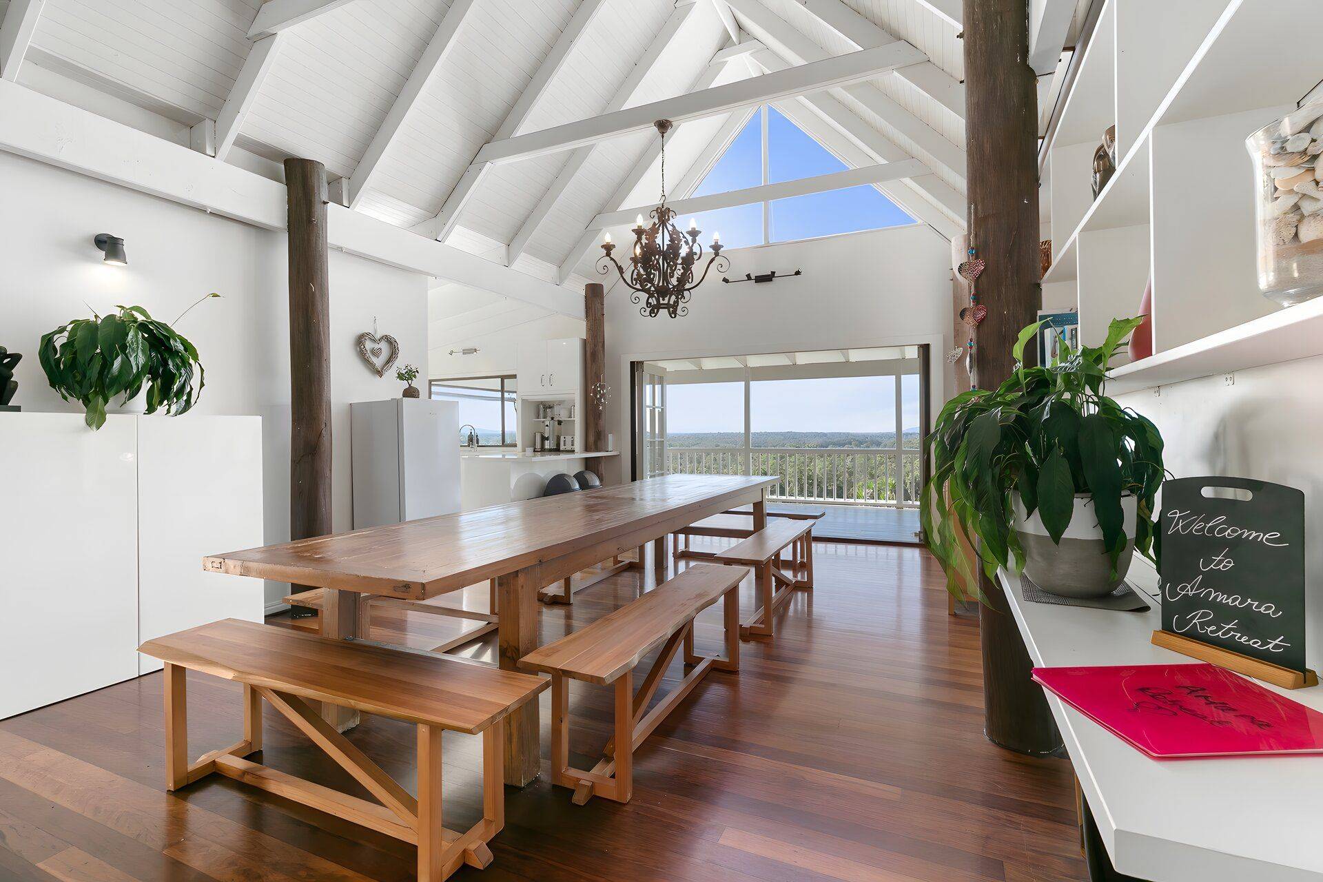 Open plan kitchen and dining room at the Holistic Bodyworker Retreat property in the Noosa hinterland