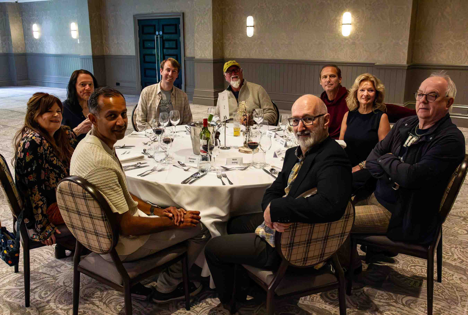 Guests sharing dinner around a table